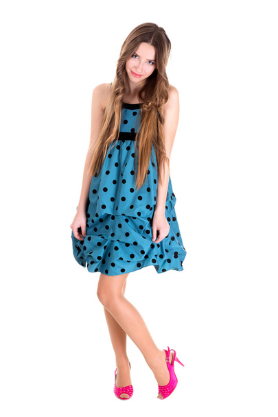 girl in a blue dress with polka dots - 写真・画像
