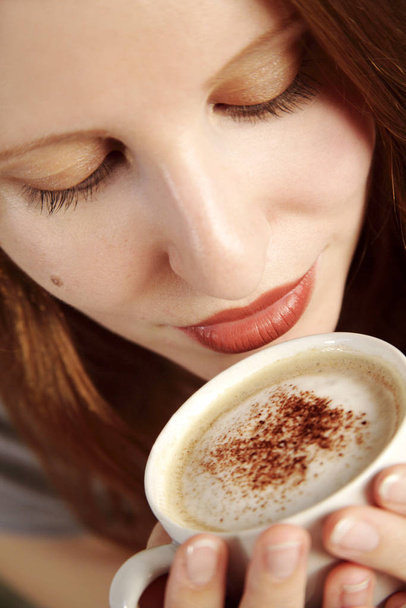 young woman with a cup of coffee - Photo, Image