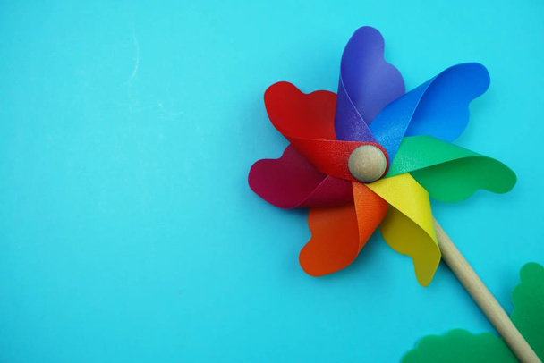 Colorful pinwheel with space copy isolated on blue background - Фото, зображення