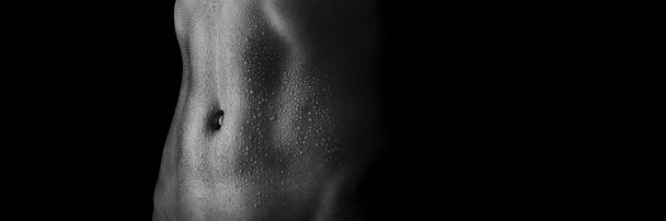 sexy women's tummy in drops of sweat - Photo, Image