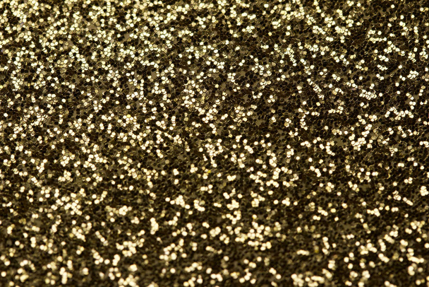 Macro abstract texture background of sparkling gold glitter with bokeh - Photo, Image