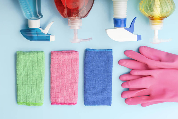 Cleaning products, gloves and rags on blue background, spring cleaning concert - Photo, Image