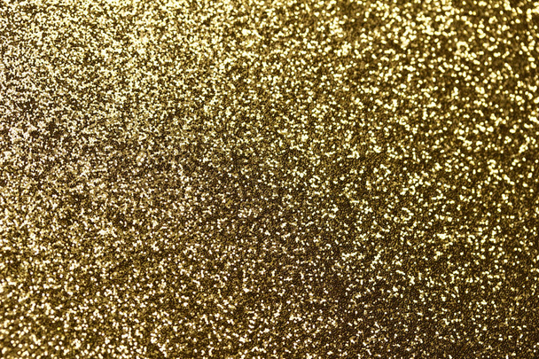 ボケで輝く金の輝きのマクロ抽象的なテクスチャの背景 - 写真・画像