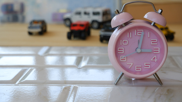 Pink Alarm Clock on the table - Photo, Image