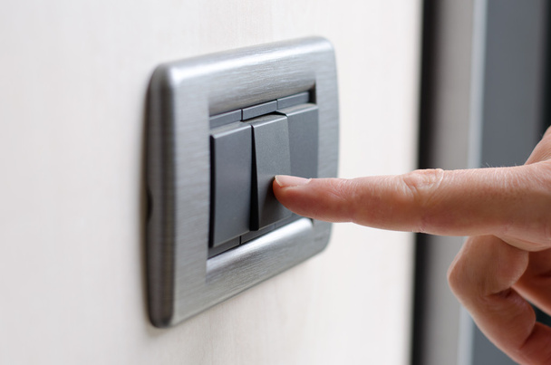 Finger pressing light switch - Zdjęcie, obraz