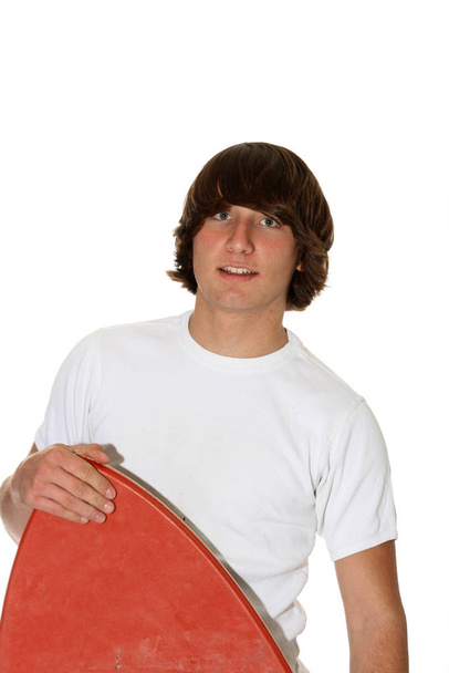 teenager with boogie board - Фото, изображение