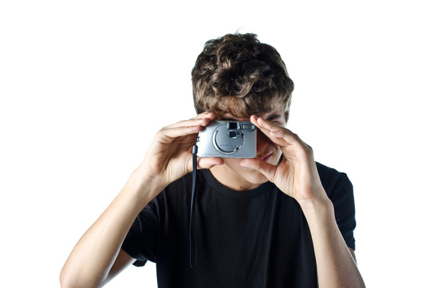 Teenage boy taking photo with compact camera - Foto, Bild