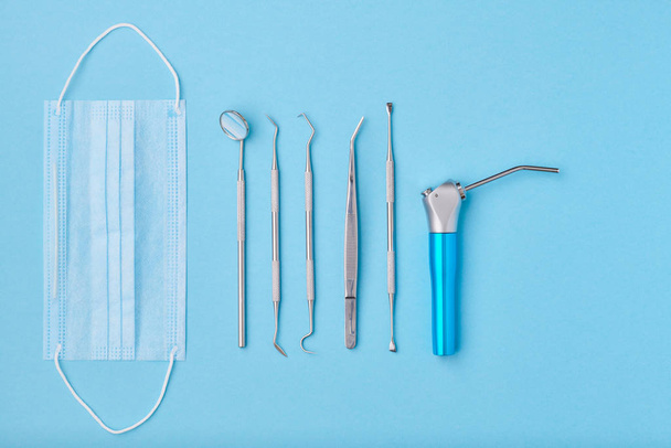 Dentist tools over blue background top view - Foto, immagini