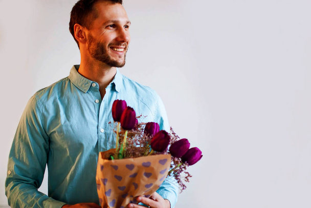 spring bouquet. 8 of march. love date with flowers. bearded man with tulip flowers. womens day. Formal mature businessman bride groom at wedding party.  - Valokuva, kuva