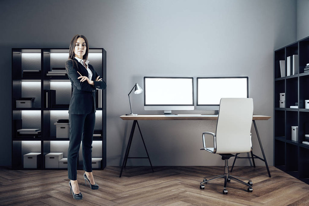 Businesswoman standing in designer room - Fotó, kép