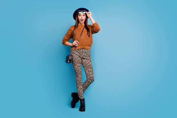 Full length photo of crazy funky girl touch specks stare see black friday discounts scream shout wear stylish trendy fall spring clothes isolated over blue color background - Foto, afbeelding