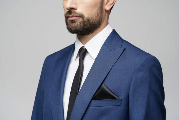 studio photo of young handsome stylish businessman wearing suit - 写真・画像