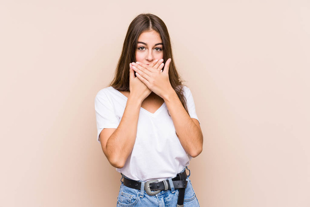 Young caucasian woman posing isolated shocked covering mouth with hands. - Photo, image