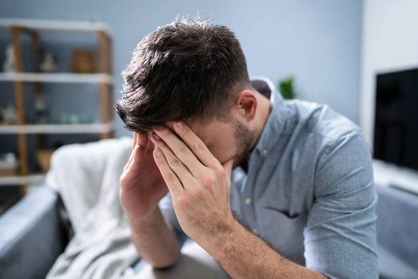 Worried Mid Adult Man Suffering From Headache At Home - Fotografie, Obrázek