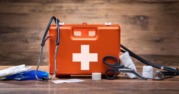 First Aid Kit With Medical Equipment On Wooden Background - Φωτογραφία, εικόνα