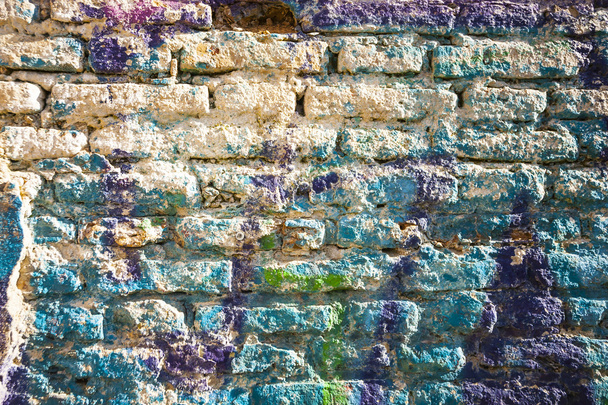 Bricks wall painted in different paint. - Photo, Image