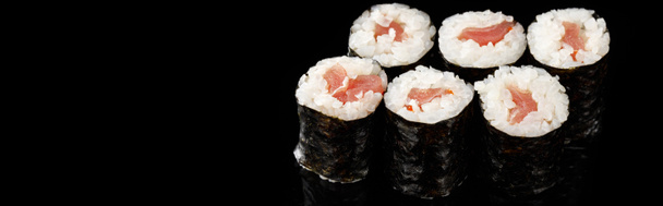 delicious sushi maki with tuna isolated on black, panoramic shot - Photo, Image
