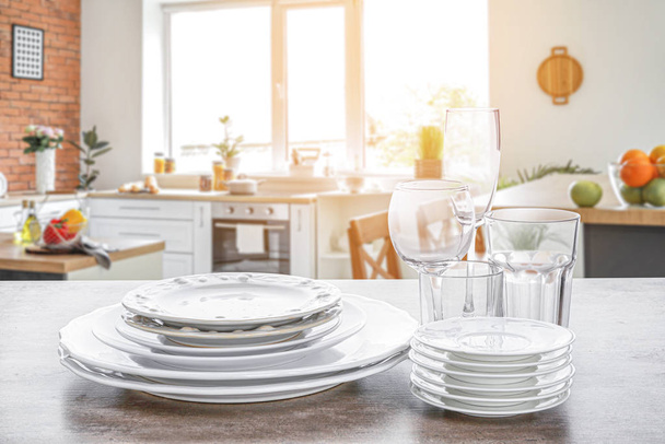Set of clean tableware in modern kitchen - Photo, Image