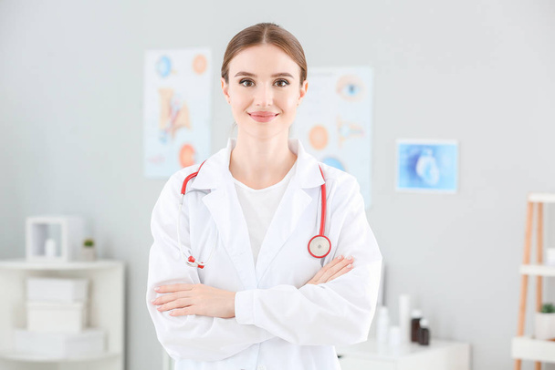 Portrait of female doctor in clinic - 写真・画像