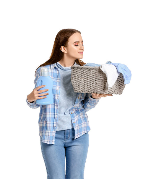 Beautiful young woman with laundry on white background - Zdjęcie, obraz