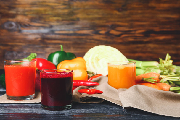 Glasses of fresh vegetable juices on table - Photo, Image