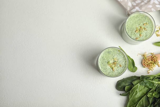 Flat lay composition with green buckwheat smoothie on white table, space for text - Valokuva, kuva
