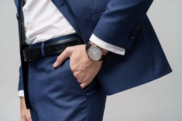 studio shot stylish businessman wearing suit and watches - Foto, Bild