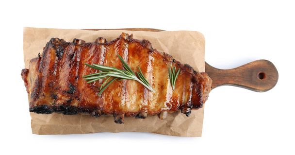 Tasty grilled ribs with rosemary isolated on white, top view - Фото, зображення