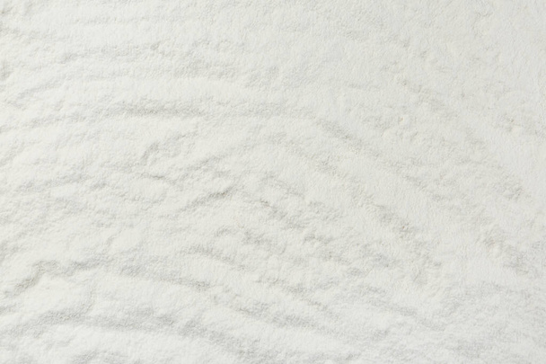Pile of organic flour as background, top view - Foto, Bild