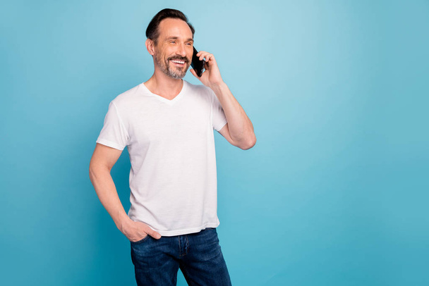 Portrait of his he nice attractive friendly cheerful cheery guy calling home social life discussing news isolated on bright vivid shine vibrant teal green blue turquoise color background - Foto, Imagem