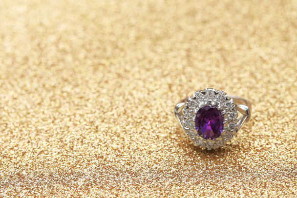 purple gemstone on diamond ring - Fotó, kép