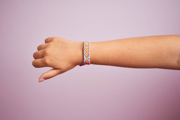 Model arm with beautiful handmade colorful bracelet on wrist - Photo, Image