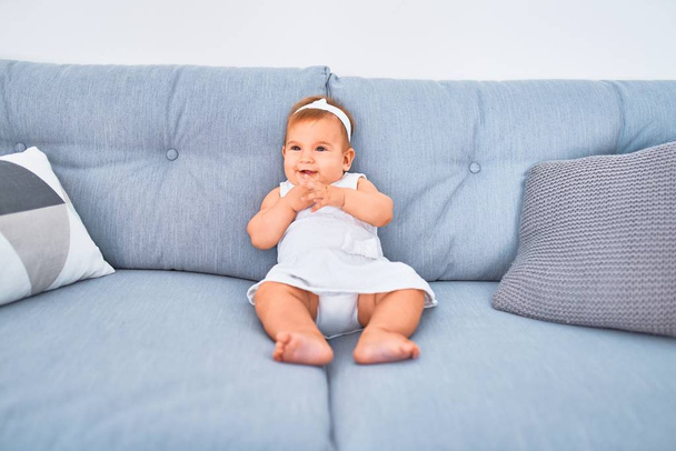Adorable baby lying down on the sofa at home. Newborn relaxing and resting comfortable - Photo, Image
