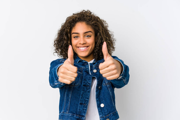 Young african american woman with thumbs ups, cheers about something, support and respect concept. - Fotografie, Obrázek