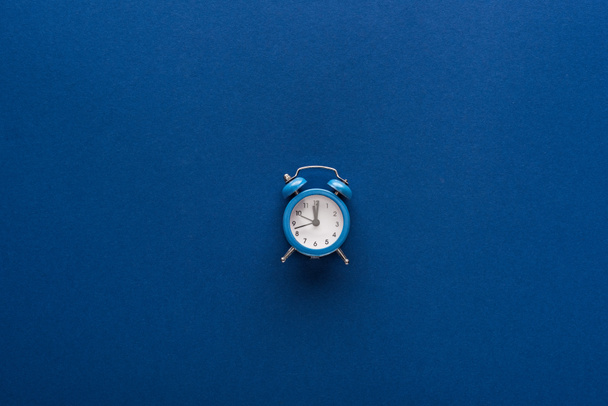 top view of alarm clock on blue background - Photo, Image