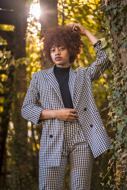 stylish young attractive african american woman posing in park - Foto, immagini