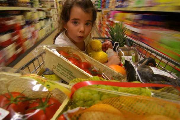 woman shopping in supermarket - Фото, изображение