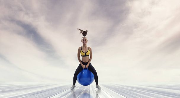 Sporty woman on fitness ball. Mixed media - Foto, Imagen