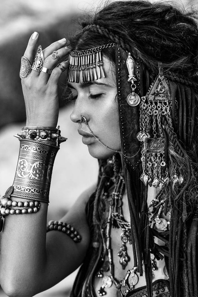 portrait of beautiful woman in native fashion concept posing to camera - Fotó, kép