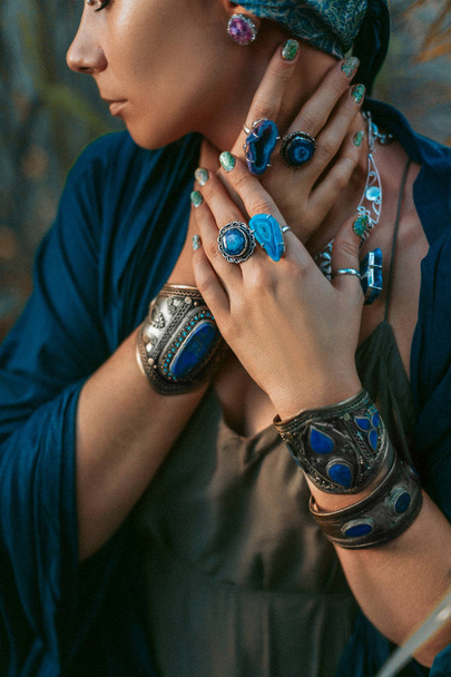 beautiful stylish woman with a lot of gem stones accessories - Photo, image