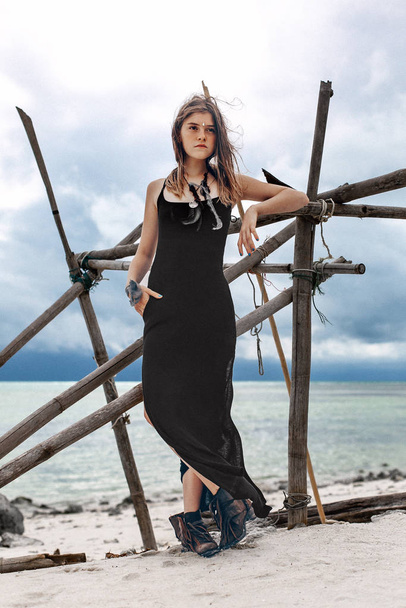 majestic young woman in dress posing on beach - Photo, Image
