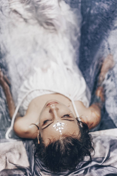 fashion shot of beautiful woman in fabric posing in water - Foto, Imagem