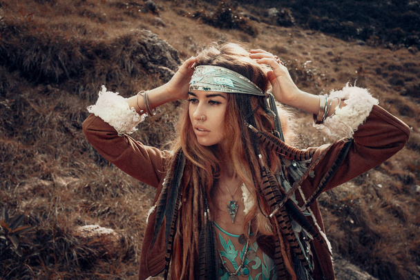 portrait of beautiful woman in native fashion concept posing to camera - Фото, зображення
