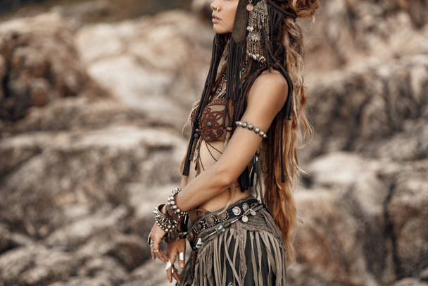 portrait of beautiful woman in native fashion concept posing to camera - 写真・画像