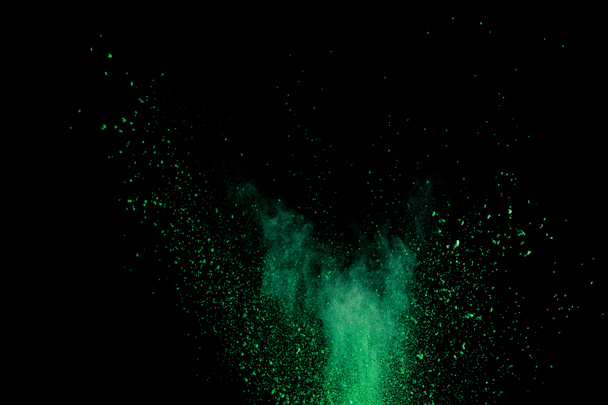 green colorful holi paint explosion on black background - Foto, afbeelding