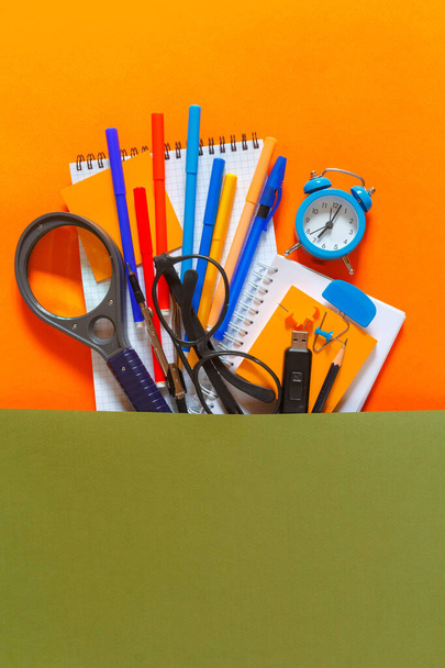 Creative flat top view of the position of school supplies stationery, education elements on an orange background. Concept back to school template for your text or design. - Φωτογραφία, εικόνα