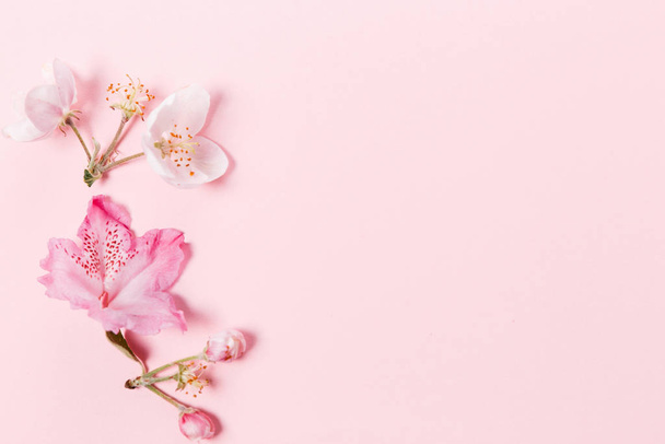 Festive flower composition on the pink background. Overhead view - Φωτογραφία, εικόνα