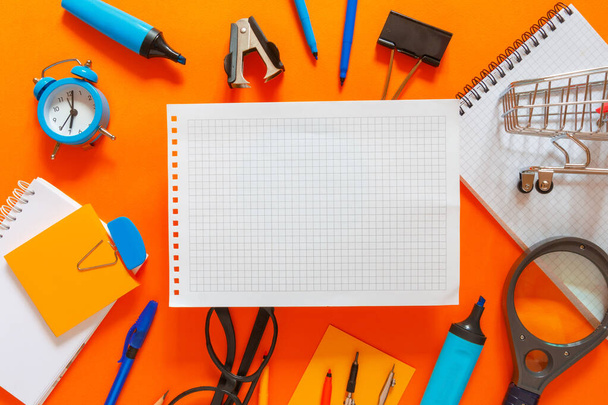 Creative flat top view of the position of school supplies stationery, education elements on an orange background. Concept back to school template for your text or design. - Fotografie, Obrázek