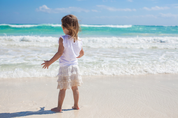 Adorable little girl on exotic white beach at sunny day - Photo, Image