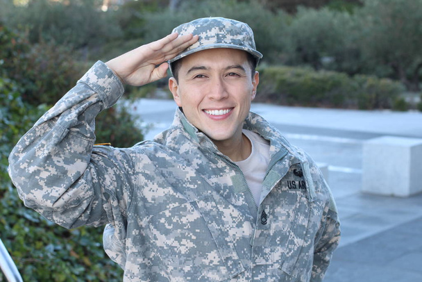 Portrait of young American soldier standing outdoors at daytime  - Foto, Imagem